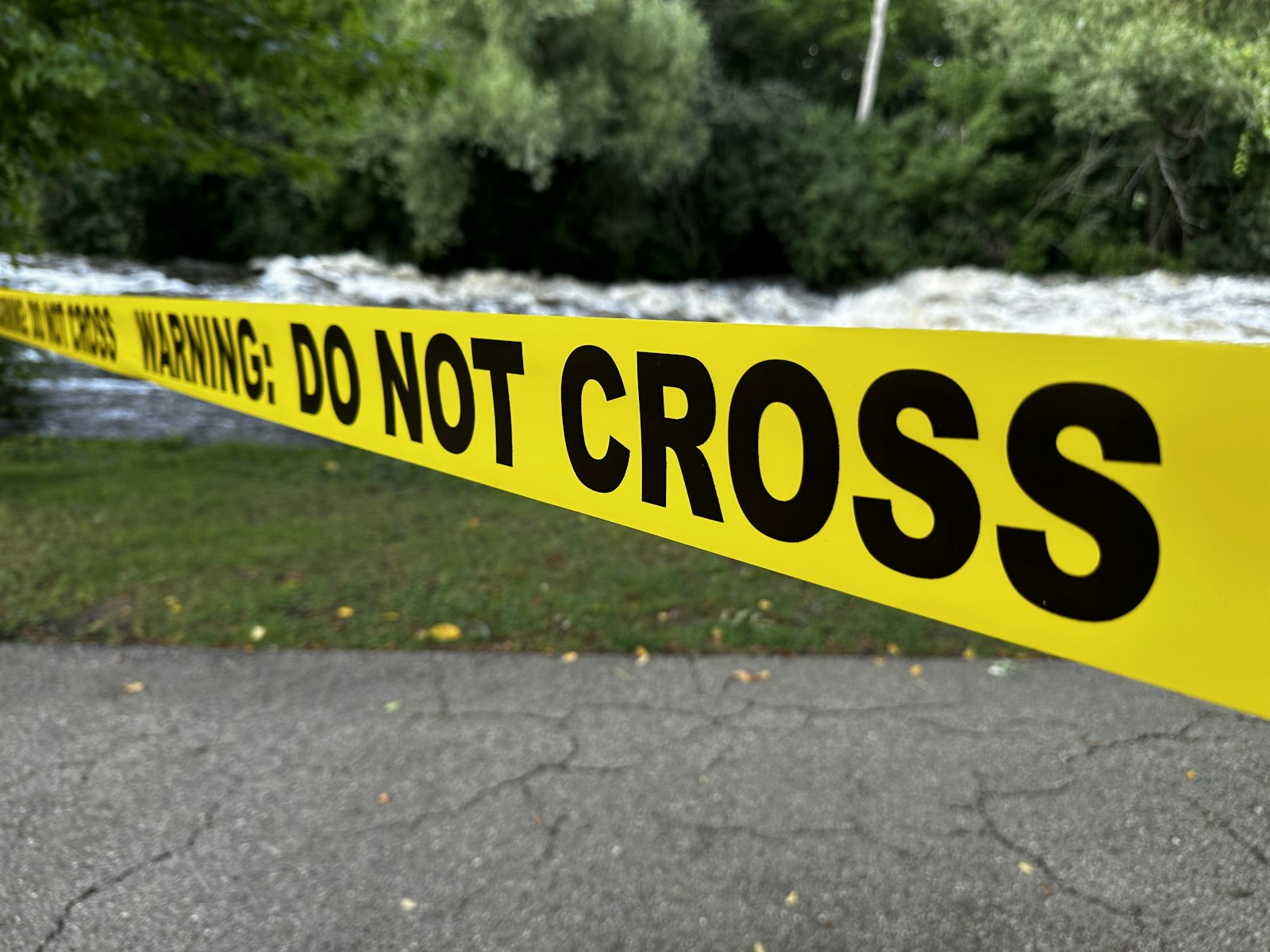 Yellow caution tape with "do not cross" text